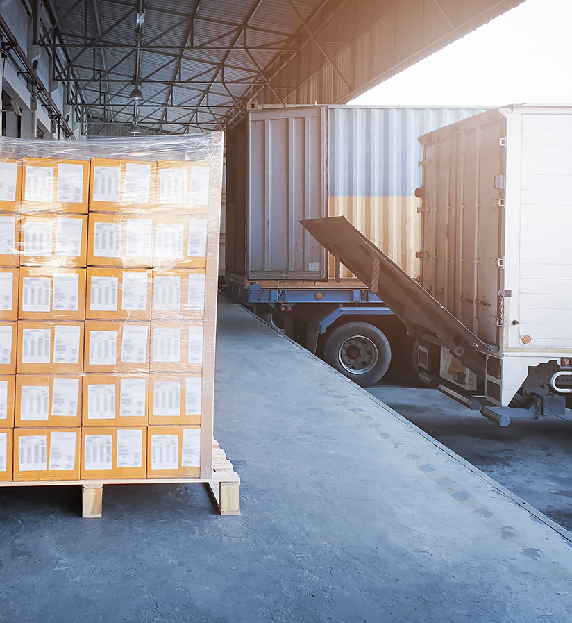 Wrapped shipment pallets waiting to be loading onto a semi truck.