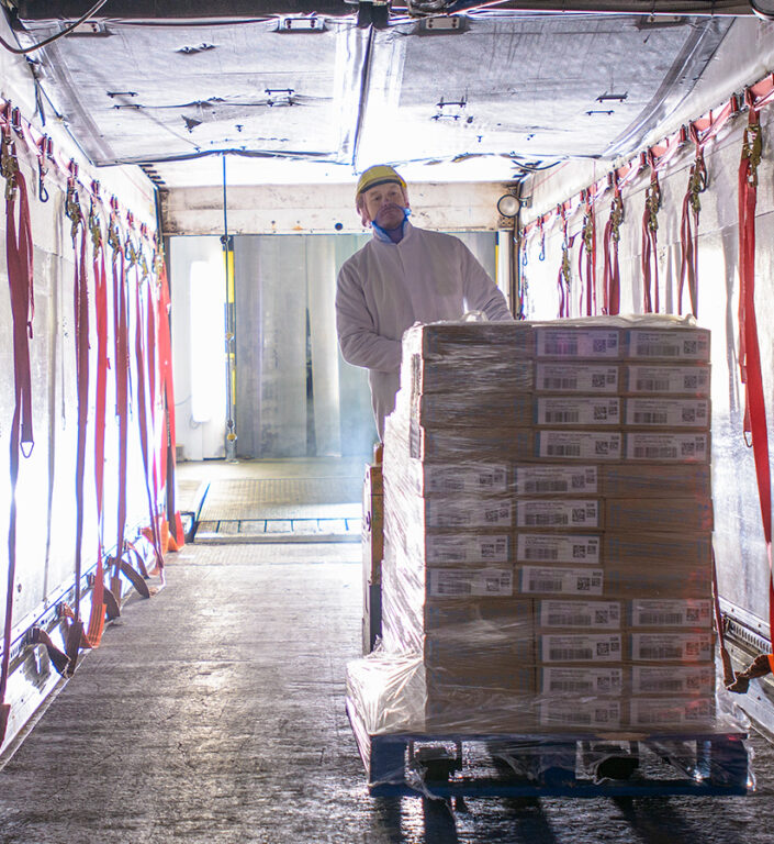 Loading temperature sensitive shipments on a temperature controlled semi truck.