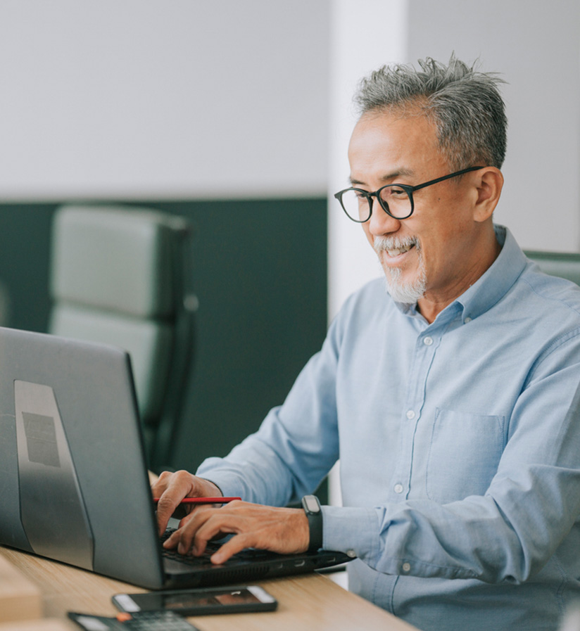 A client sitting at a laptop booking his next shipment.