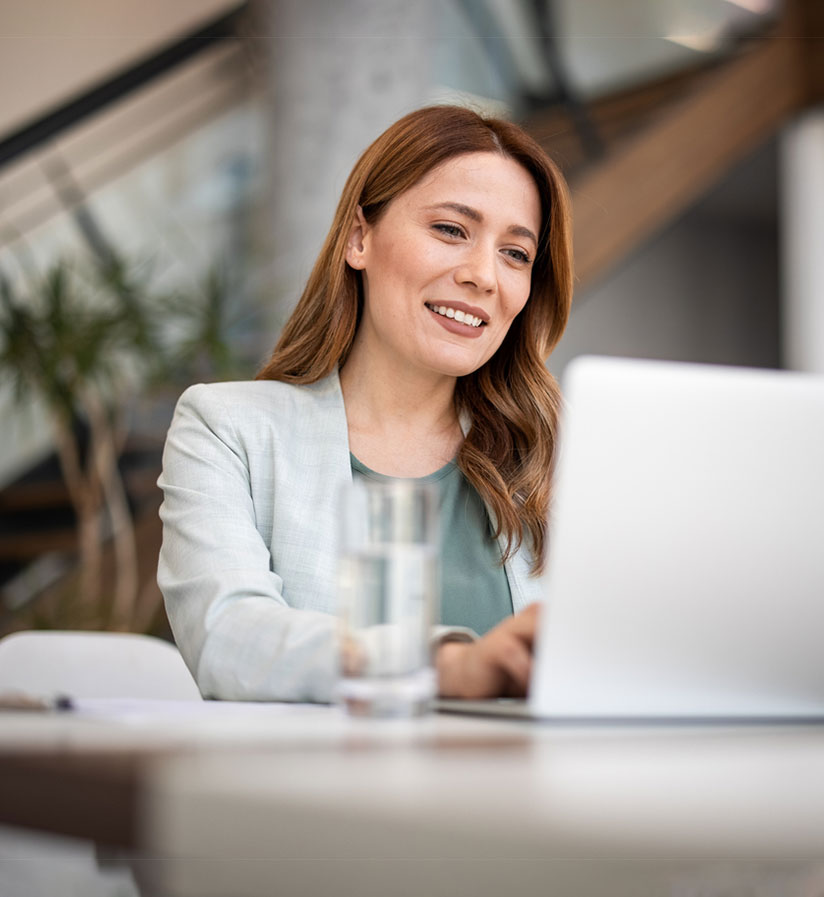 A client sitting at their laptop booking their next shipment with Roadtex.